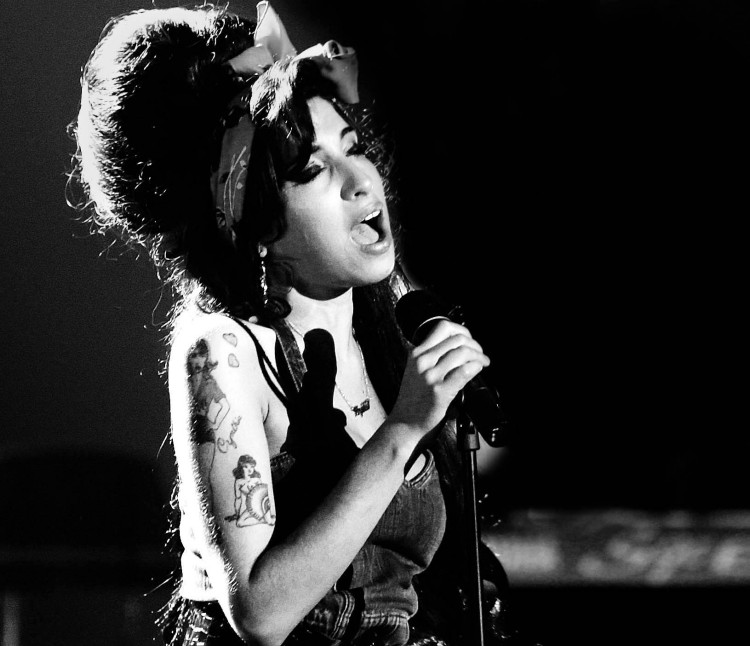 File photo shows singer Amy Winehouse performing during the MTV Europe Awards ceremony in Munich