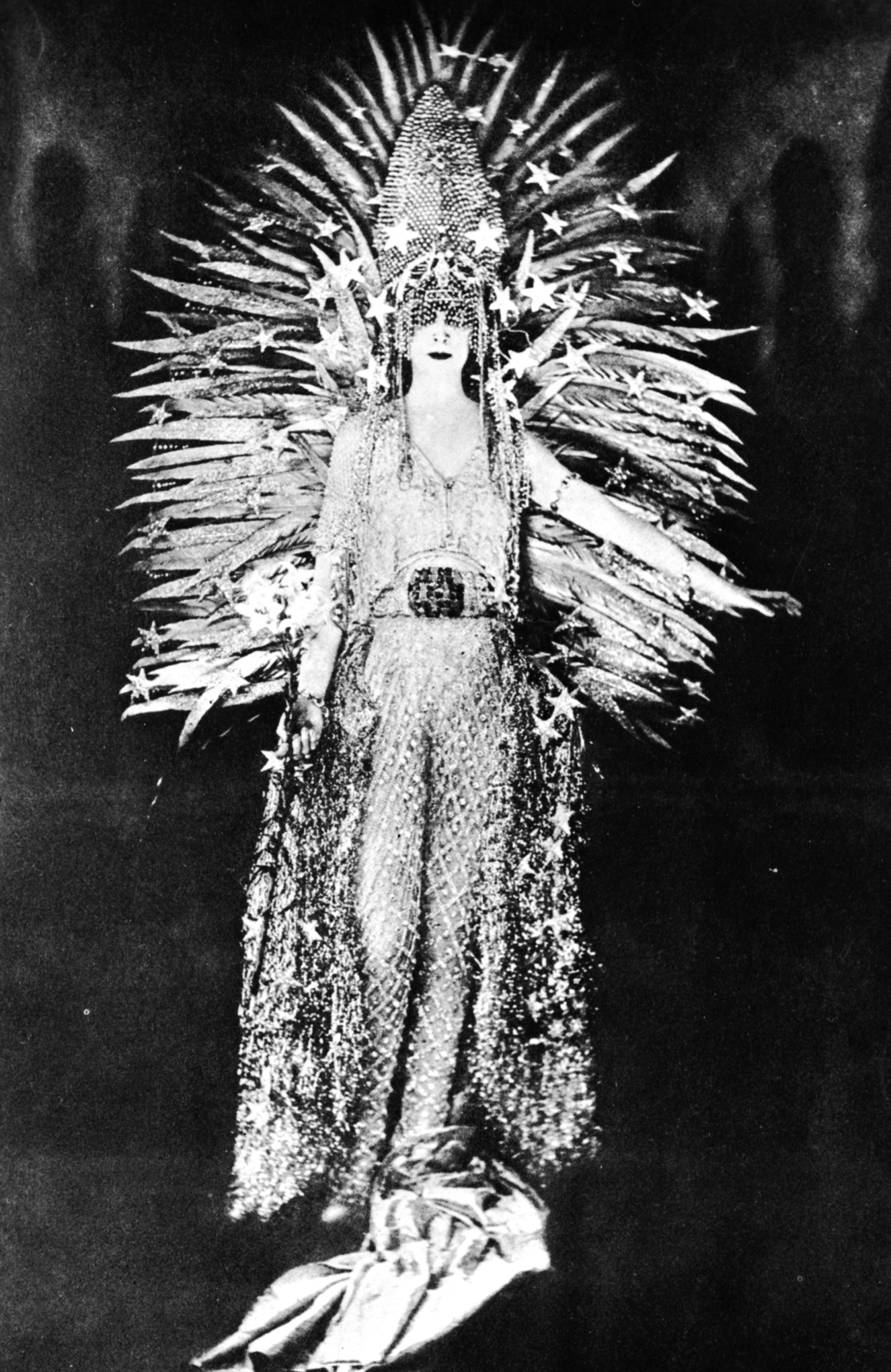 Marchesa Luisa Casati wearing a costume symbolising light to a fancy dress party in Paris, 1922. The costume, designed by Worth, is made of a net of diamonds, i