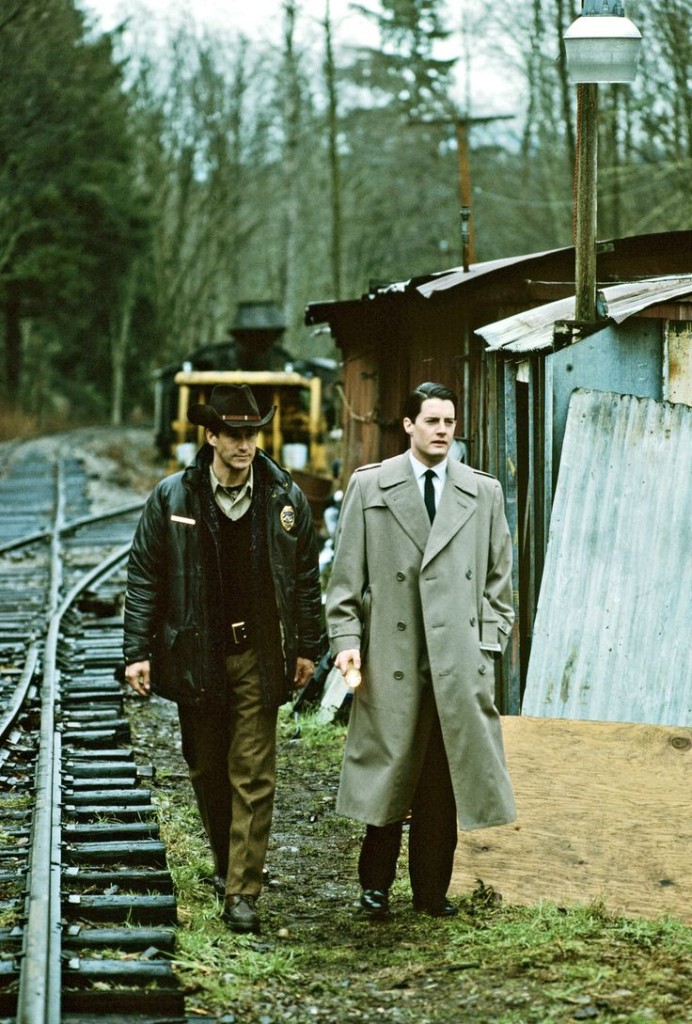 UNITED STATES - APRIL 08:  TWIN PEAKS - Pilot - Season One - 4/8/1990, Homecoming queen Laura Palmer is found dead, washed up on a riverbank wrapped in plastic sheeting. FBI Special Agent Dale Cooper (Kyle MacLaughlin, right) is called in to work with local Sheriff Harry S.Truman (Michael Ontkean) in the investigation of the gruesome murder in the small Northwestern town of Twin Peaks. ,  (Photo by ABC Photo Archives/ABC via Getty Images)